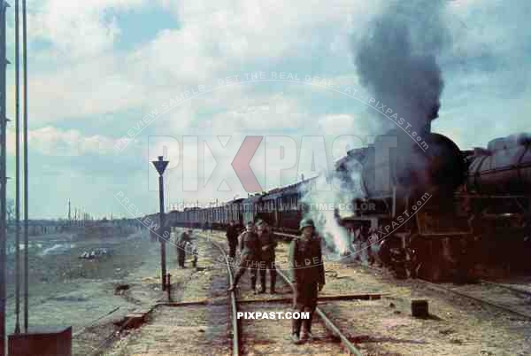 2 Large troop transport Locomotives stopping to let soldiers stretch their legs before continuing to the Eastern Front 1942.