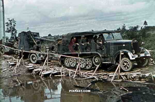 88mm artillery piece is towed by a SdKfz 6 half-track, 19th Panzer Division, Minsk, Russia 1941.