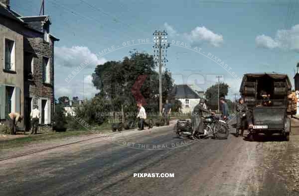 94. Infantry Division Radio Funker Signals Unit install telephone lines in french village, France 1940.