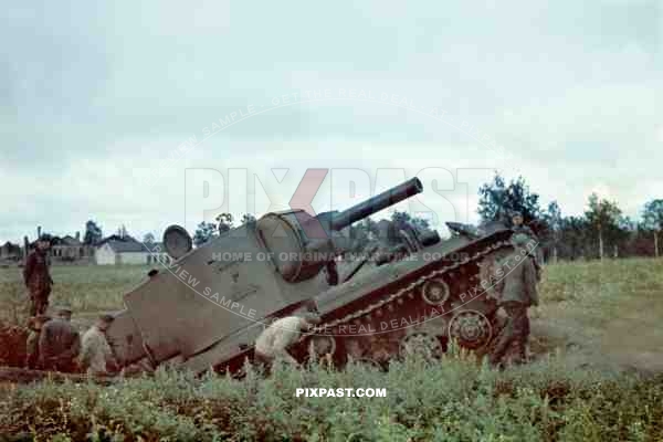 A captured Soviet Russian KV 2 Bunker Buster Heavy Assault Tank. Russian Front 1941. Being inspected by German soldiers.