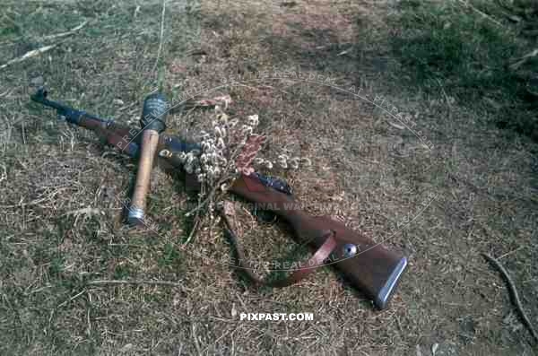 A German soldier photographs his weapons. Polish Russian border summer 1944. 