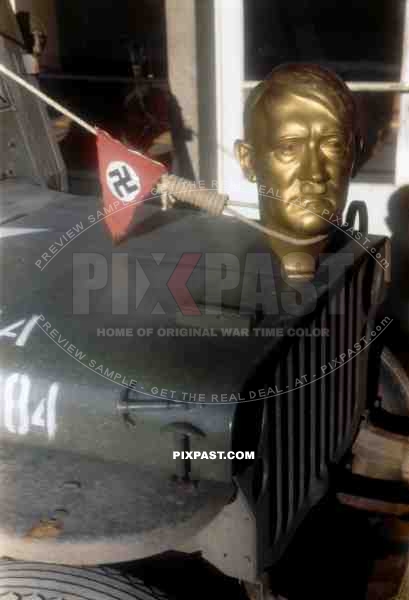 Adolf Hitler statue head bolted to front of American Willi Jeep as   war trophy, Heidelberg Germany 1945. 101st Cavalry Regiment.