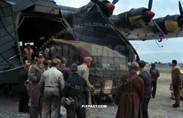 Afrika Korp Horch 901 unloaded from Messerschmitt Me 323 "Gigant" Transport Plane , El-Aouiana Airport, Tunisia 1942.