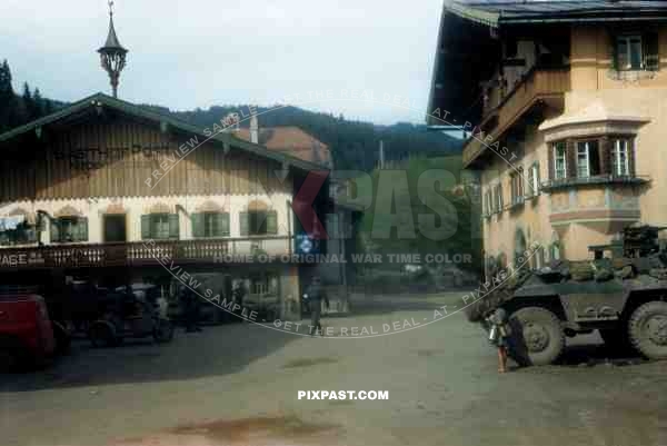 American armoured cars of the 101st Cavalry Regiment park opposite SS troops in Kossen Austria 1945.