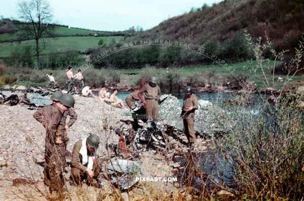 American Gi soldiers inspect a crashed American bomber aircraft near Worms Germany 1945. Near Rhine