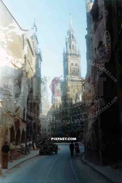 American Willi Jeep enters Marienplatz Munich 1945 beside badly destroyed Neues Rathaus, City Hall. Destroyed City. 