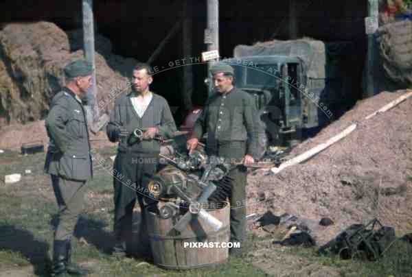 Army mechanics beside repair truck in Khislavichi, area Smolensk, Russia 1942,  10th Motorised infantry division