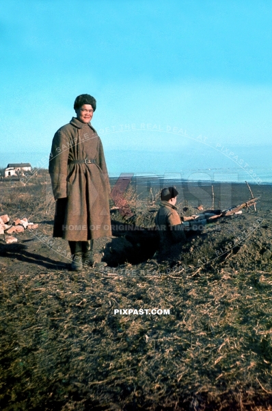 Asian Soviet troops in Russian uniform manning German rifle bunker position on side of Volga near Stalingrad 1942