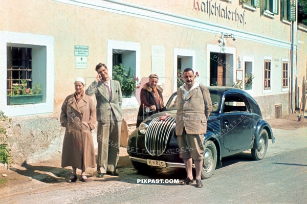 Austrian family going on weekend road trip in their 1936 Steyr Typ 50 in front of the Guest house . Austria 1939