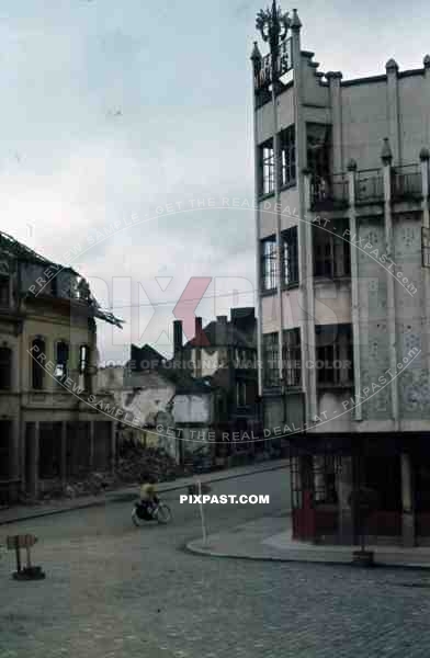 Belgium 1945 color Bombed town city Hotel bike sign posts