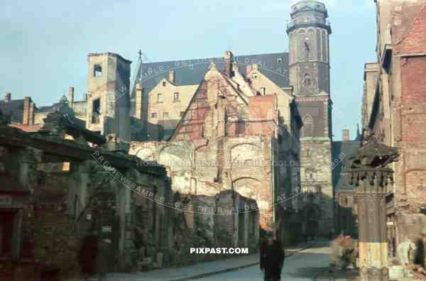 Bombed houses on Burg Strasse in Leipzig 1946. Showing the Thomaskirche in background.