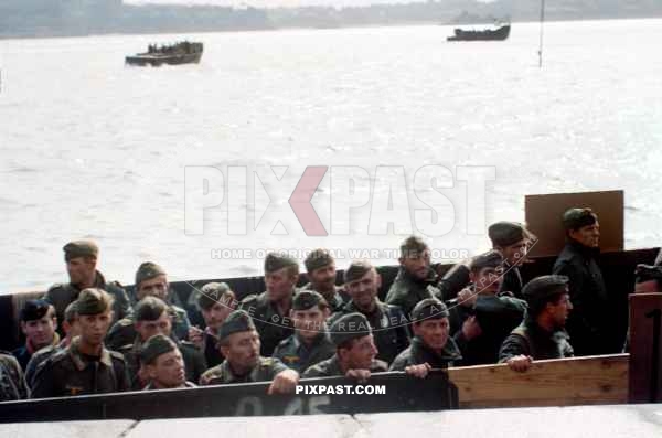 Captured German Coastal Artillery soldiers POWs being sent back to England after the D-Day Invasion.