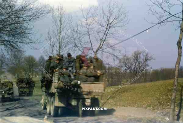 Captured German Luftwaffe POWs on American GMC Jimmy trucks near Wesel Germany on the Rhine. After Varsity. 1945