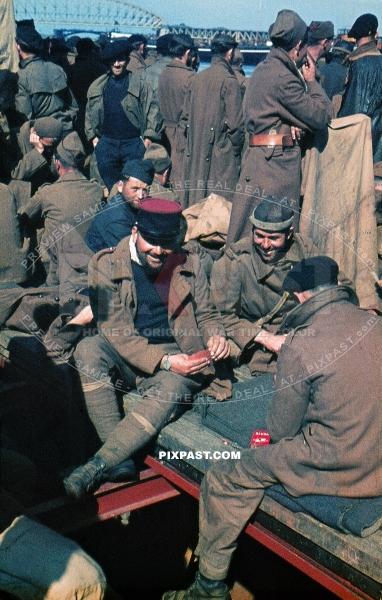 Captures French Military POW soldiers playing cards. Waiting for transport to Prisoner of War Camps in Germany. 1940