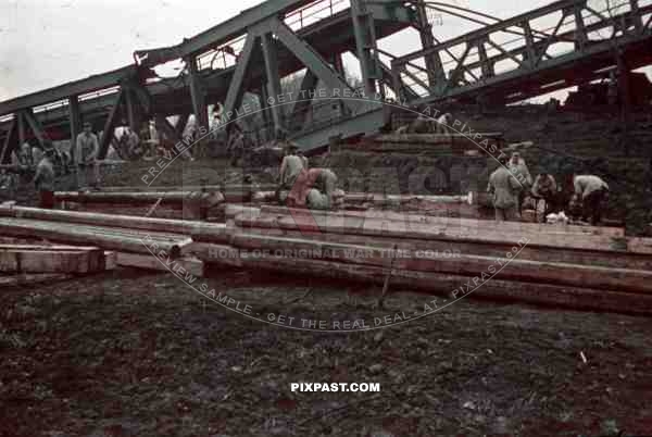 construction of a wooden bridge next to a broken rail bridge near Belgrade, Serbia ~1941