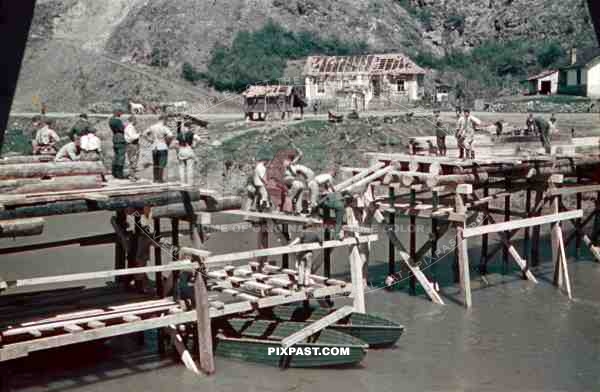 construction of a wooden bridge next to a broken rail bridge near Belgrade, Serbia ~1941