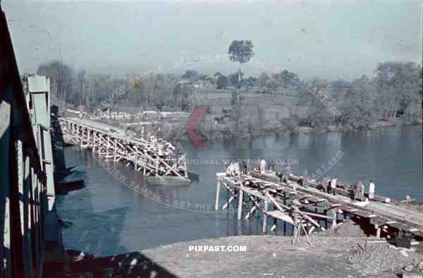 construction of a wooden bridge next to a broken rail bridge near Belgrade, Serbia ~1941