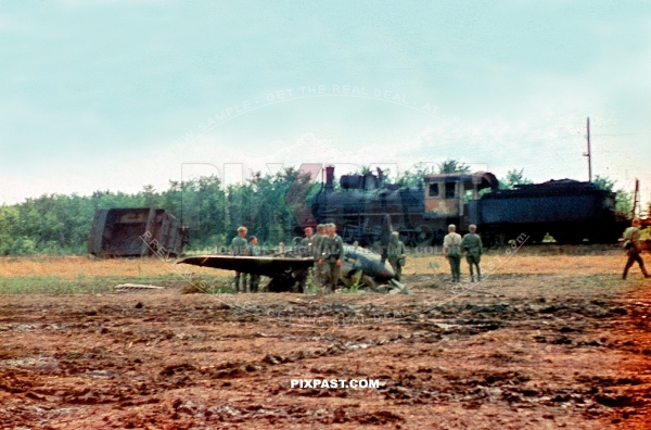 Crashed Russian fighter plane YAK 9 in front of blown up and burned Russian train. Russia 1940. 297 Infantry Division