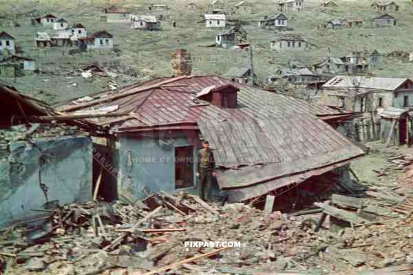 Destroyed Civilian housing and farms on the outskirts of Sevastopol 1942. German soldier standing in the middle of ruins