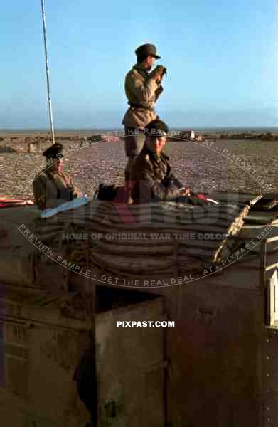 Field Marshal Erwin Rommel watching battlefield 1941 Tunisia in Captured British armoured truck MAX. MAMMUT