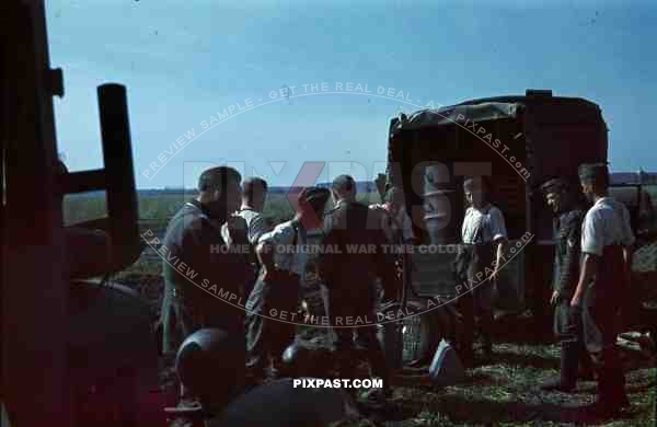 filling petrol tanks trucks russia 1942