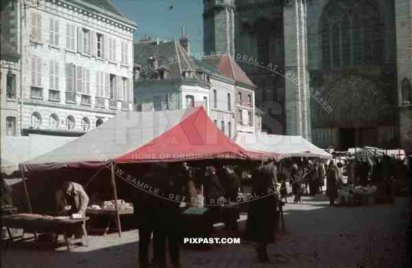 Food and Flea Market behind Notre Dame Cathedral, Paris, France, 1940.