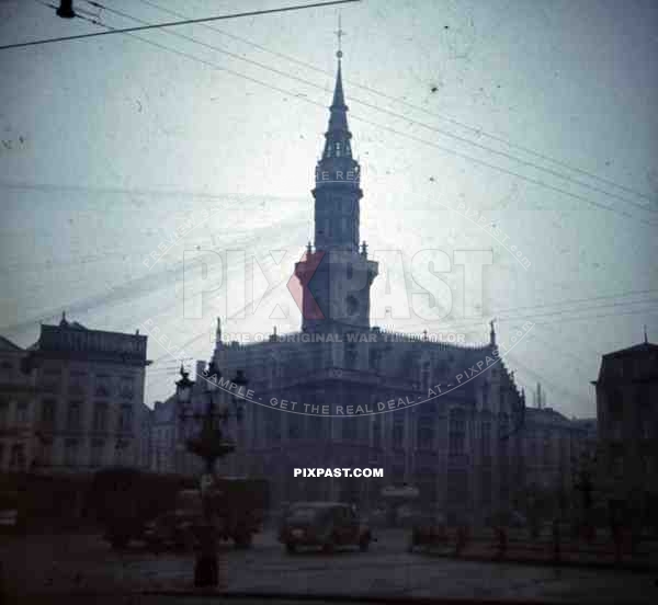 French town city hall market square German Wehrmacht truck supply column staff car clock tower 1940