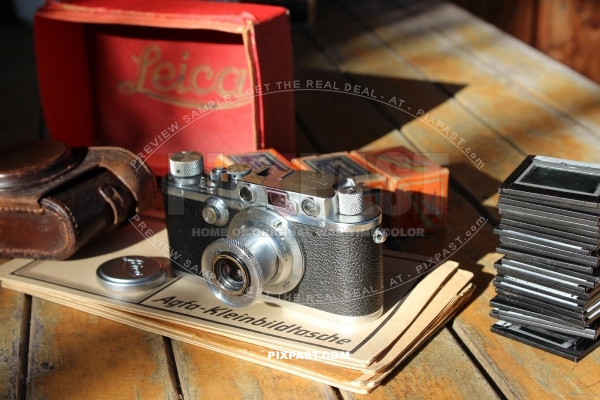 German 1934 Leica III camera with Elmar 5cm F3,5 lense. Original leather bag and Leica red box.