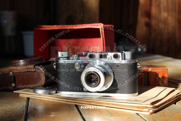 German 1934 Leica III camera with Elmar 5cm F3,5 lense. Original leather bag and Leica red box.