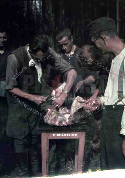 German army butcher cutting fillets of meat for troops. 10th Motorised infantry division repair werkstatt Bryansk 1941