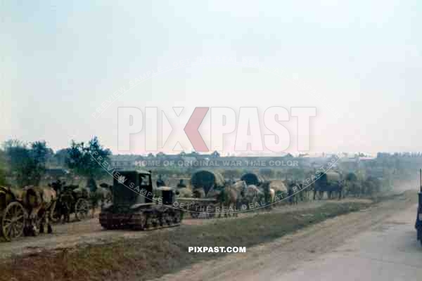 German army cavalry passing a captured Russian army tractor. Russian front 1942