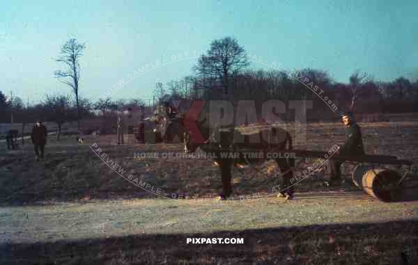 German army horse wagon beside captured French Char B1 Panzer Tank, outside of Paris, 1940.