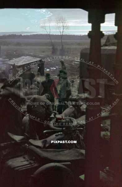 German army Motor bike messengers rest beside their BMWR12 with sidecars. Russian front 1942.