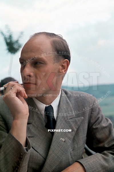 German army officer in civilian clothing wearing iron cross miniature medals. Lindau 1944 Germany