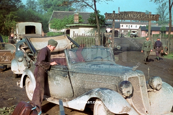 German army officers in Opel Staff car. Austellungsplatz. Camp. Russia 1942.  297 Infantry Division