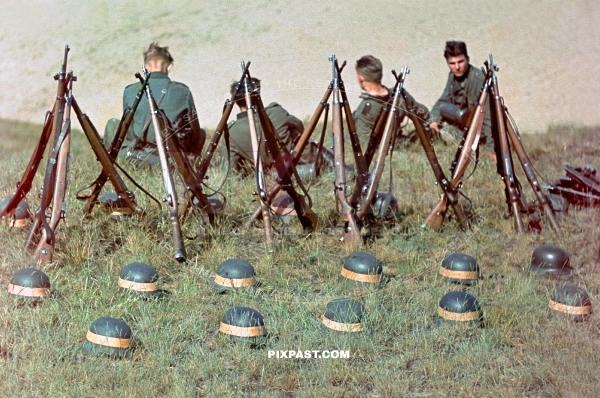 German army soldiers training with Kar98 rifles and yellow rubber band helmets. 8th Panzer Division. Russia August 1942