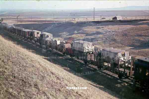 German army transport train in Russia 1944. White wash army trucks towards the front.