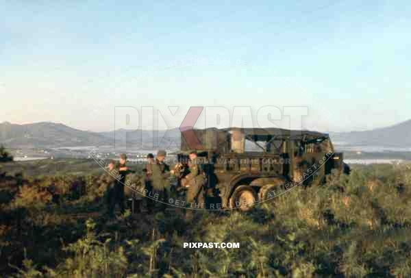 German Bussing NAG G31 Kfz.77 radio truck. Unloading portable radio sets, Sicily May 1943.