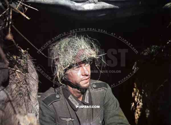 German Field Soldier with camouflage helmet in Normandy, France 1944