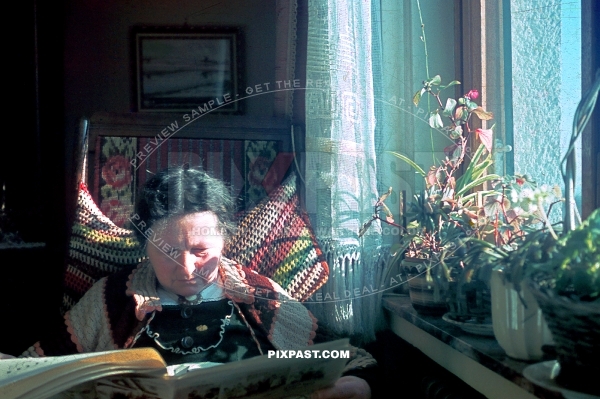 German granny sitting down reading the newspaper. Bavaria Germany 1939