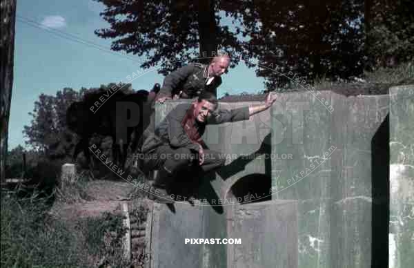 German infantry soldiers inspecting captured French Maginot Line bunker. France 1940.