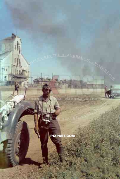 German Luftwaffe photographer and reporter Otto Vieth in Russia Summer 1942. With his Leica III camera.