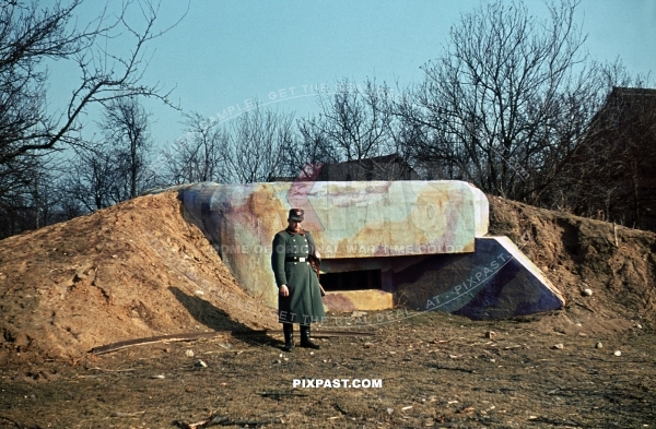 German military police man guarding captured French camouflage machine gun bunker France 1940