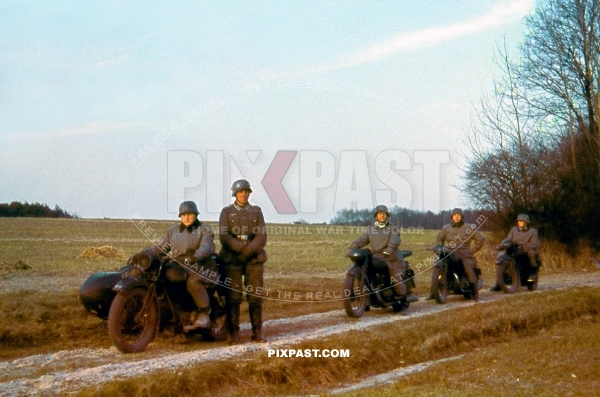 German motorbike messengers Kradmelder resting on dirt road. France 1940