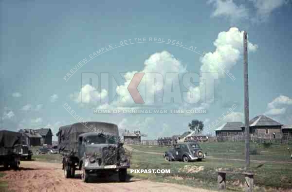 German Opel Blitz supply truck with camouflage, Redcross car with staff,  Russian Village, 19th Panzer Division, Minsk 1941.