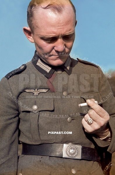 German Private army soldier in uniform smoking a cigarette. Large gold ring on finger. 4th Panzer Division France 1940