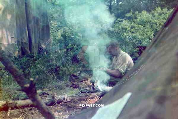 German soldier camping in French woods 1940. Zeltbahn and drying out sheets.