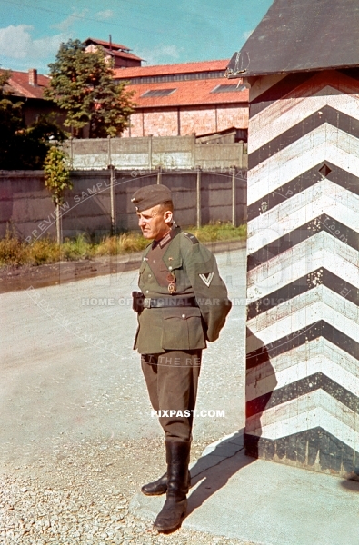 German soldier Obergefreiter Infantry unit 899 on guard WACHE in Poland 1939. Wearing SA Sports Badge in bronze