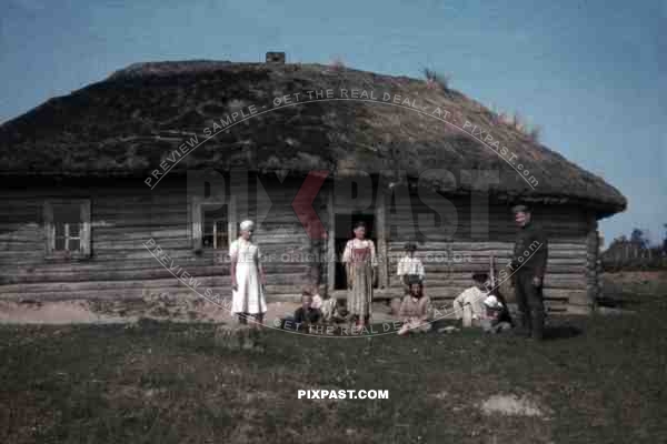 German soldier with local village family, 10th Motorised infantry division repair werkstatt Bryansk 1941