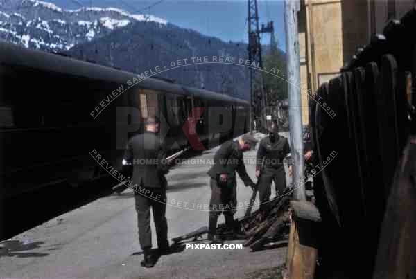 German soldiers surrendering weapons beside General Albert Kesselrings private train, Saalfelden Austria 1945